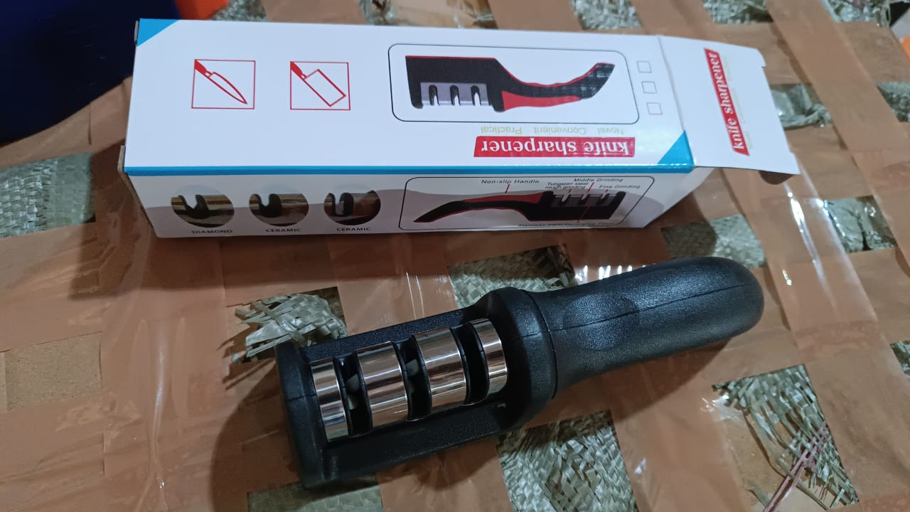 Manual Red & Black Knife Sharpener 3 Stage Sharpening Tool for Ceramic Knife and Steel Knives. Manual Red & Black Knife Sharpener 3 Stage Sharpening Tool for Ceramic Knife and Steel Knives.